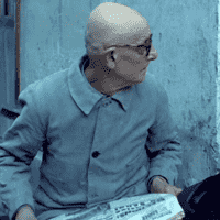 Man Reading Newspaper