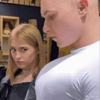 Girl staring at Guy's chest